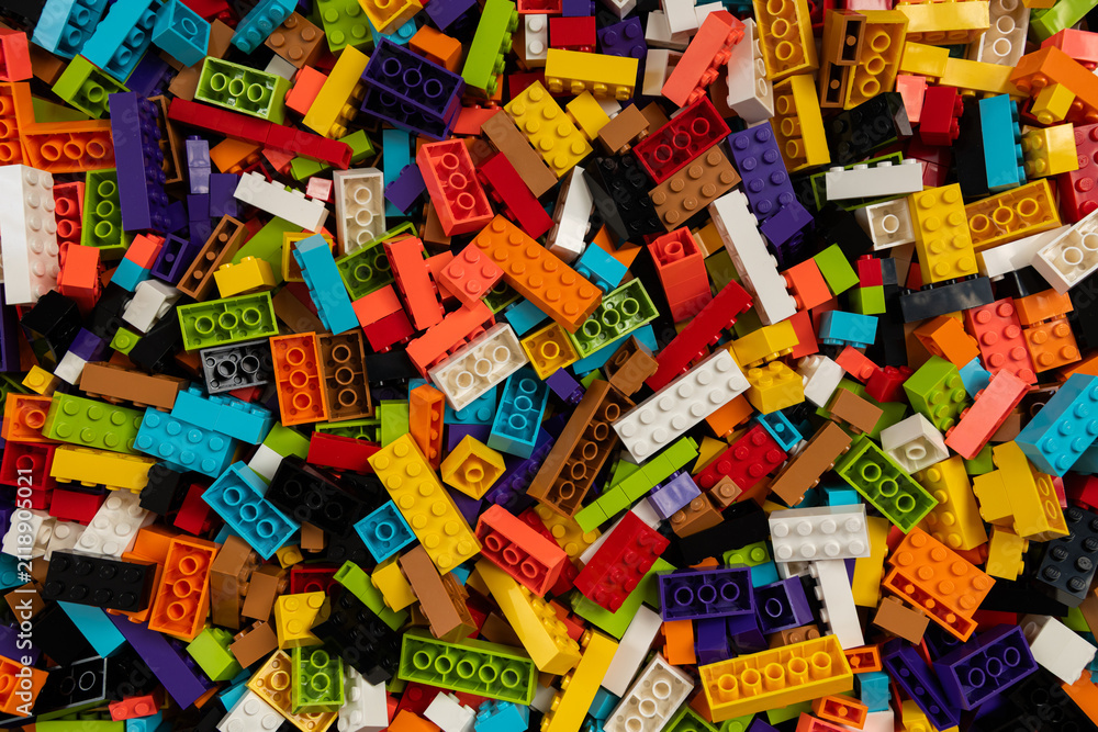 Fototapeta premium Colorful mix of plastic Lego building blocks and bricks background