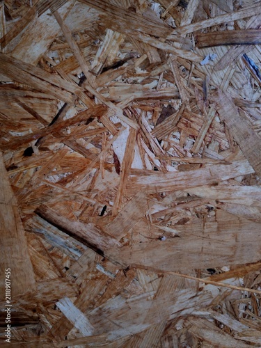 Smooth pressed wood particle board surface with natural timber shades, abstract construction material background
