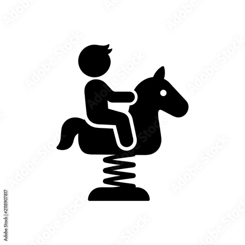 Child riding a spring rocking horse icon