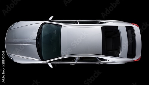 top down view of a modern silver car showcasing the vehicle s roof windshield and interior details on a black background