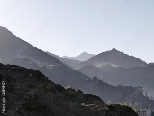 Scenic morning sky and layered mountains landscape in Leh city with the palace and monastery in Ladakh, Himalaya