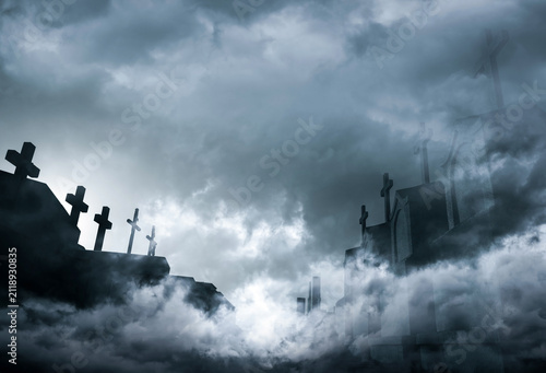 Quadro su tela Cemetery or graveyard in the night with dark sky and white clouds