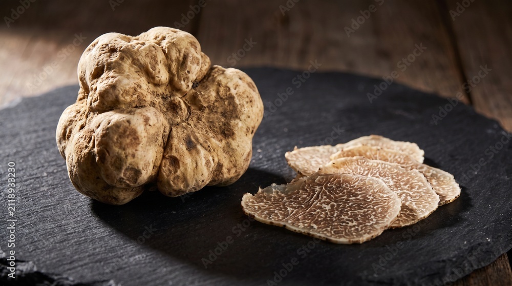 Obraz premium White Alba truffle whole sliced shavings marbled interior luxury rare ingredient macro
