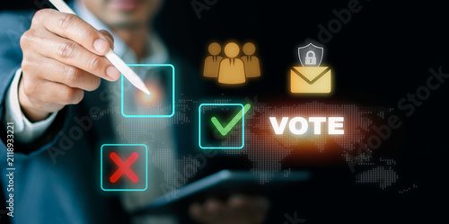 Businessman using stylus for electronic voting and secure digital ballot concept. Virtual check box option, encrypted email vote, corporate governance, and election polling.