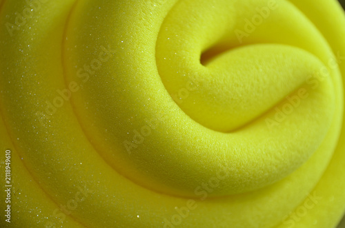 detail of golden yellow sponge foam bundled in a spiral shape