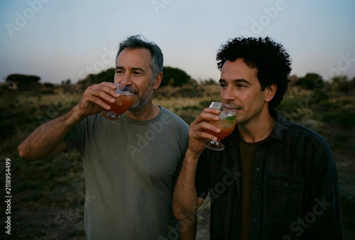 Two men enjoying refreshing...