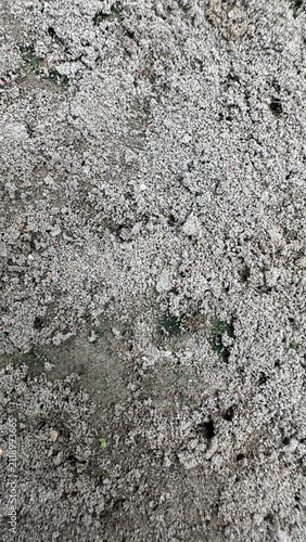 Texture of gray granular soil and coarse gravel dirt