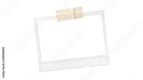 Polaroid photo taped to a wall with beige masking tape isolated on transparent background
