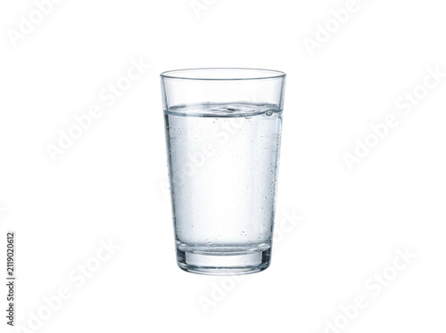 A clear glass filled with refreshing water is centered against a white backdrop. The simplicity and clarity of the water emphasize purity and hydration.