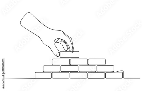 One line continuous building house Hand arranging bricks.