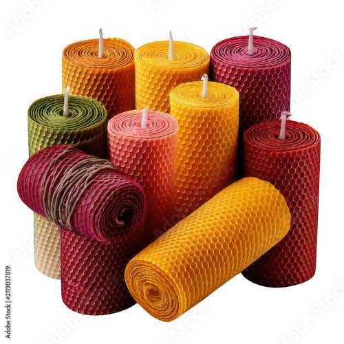 Group of colorful handmade beeswax candles with a textured honeycomb pattern for spa wellness and home decoration isolated on transparent background