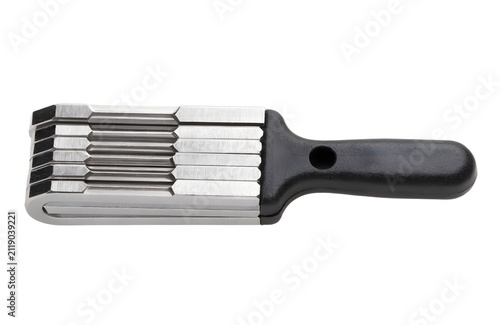 Folding hex key set in closed position. Metal allen wrench tool for mechanical repair.