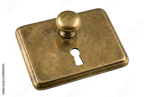 Vintage brass keyhole plate with knob on black background