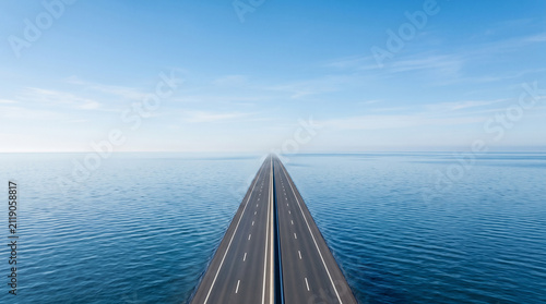 Surreal aerial view where an endless ocean transforms seamlessly into a modern highway disappearing toward the horizon 