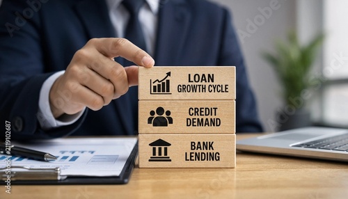 Business professional demonstrating loan growth cycle credit demand and bank lending concepts with wooden blocks