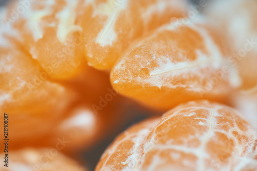 Картината върху платно Macro close-up shot of juicy peeled mandarin segments showing vibrant orange tex
