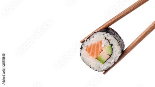 Single piece of fresh salmon sushi maki roll held by wooden chopsticks isolated on transparent background