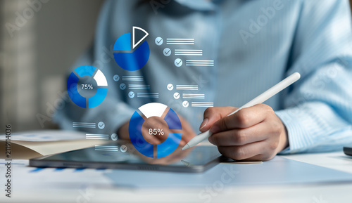 Businesswoman reviewing digital checklist and budget reports for accounting audit, financial approval, compliance inspection, internal control and corporate governance.