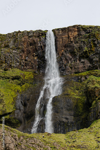 Majestic Mossy Waterfall Cascading Down Basalt Cliffs
