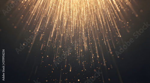 golden light rays with falling glitter particles on dark background for luxury award ceremony and celebration concept