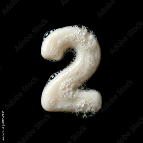 Solid soap with bubbles and foam number 2 -creative digit isolated on black background. Perfect alphabet for creative illustrations related to beauty, hygiene, purity...