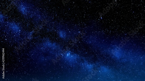 Starry sky shining across deep space background with vibrant blue nebula and milky way galaxy for science and educational marketing