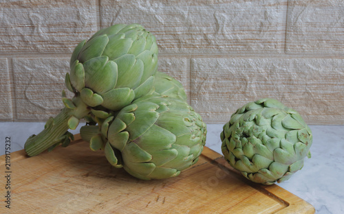 Artichokes on a table, winter seasonal vegetable, healthy food.