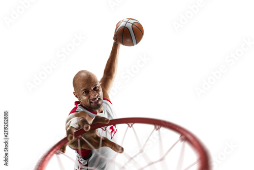Basketball player in a jump throws the ball into the ring. Close-up. Professional basketball player in action. Sports energy. Sports emotions. Isolated