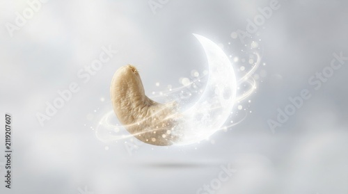 Cashew nut shaped like a crescent moon with magical light sparkles