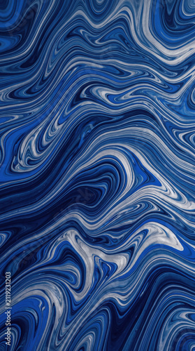 Abstract fluid art background with swirling blue and silver acrylic paint