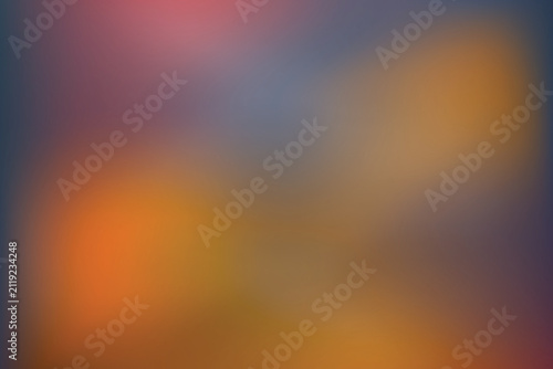 Abstract blurred background with soft gradients of orange, blue, and purple colors