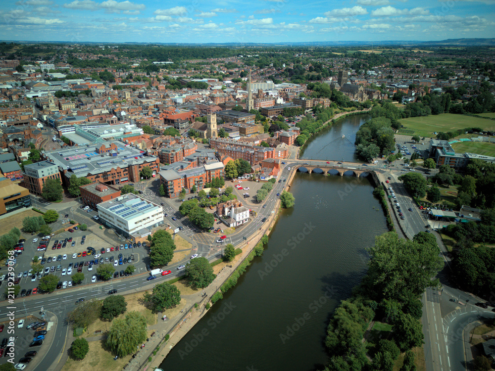 Fototapeta premium WORCESTER, WORCESTERSHIRE, ENGLAND - An aerial drone view looking over Worcester Bridge and the River Severn in the historic city centre.