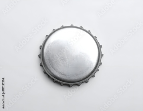Single Blank Metallic Beer Bottle Cap Isolated on a Plain White Background