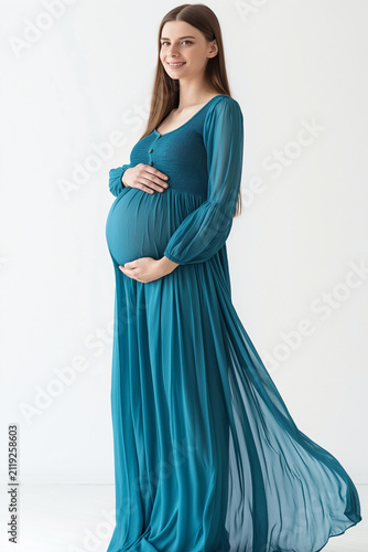 Pregnant woman in blue dress isolated on white background