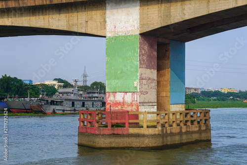 Massive Concrete River Bridge Pillar Standing in the Water