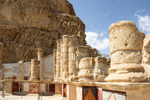 Remains  of interior walls with the columns in northern palace of the Masada fortress and adjacent plain in southern Israel near Arad