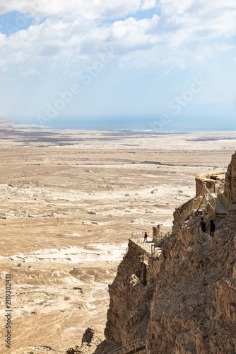 Ruins of the northern palace of Masada and adjacent plain with Dead Sea in southern Israel near Arad
