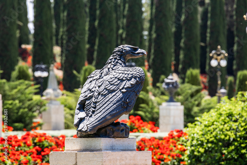 Decorative eagle statue as decoration in Bahai Gardens near Acre city in northern Israel.