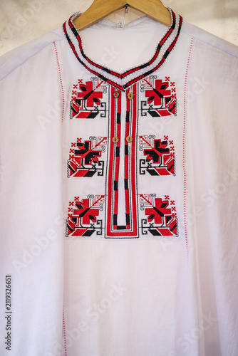 Traditional women's clothing for sale at a market in Bulgaria.
