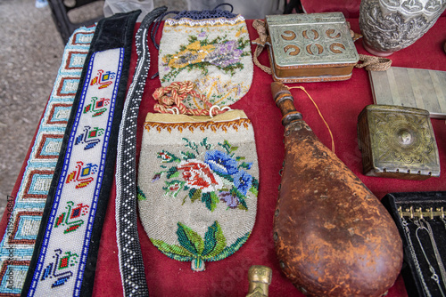 Фотография Beaded bags and a wineskin for sale at a market in Bulgaria.