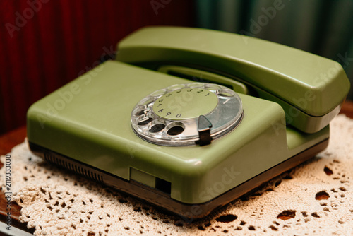 Bild auf Leinwand old green vintage rotary phone, closeup view