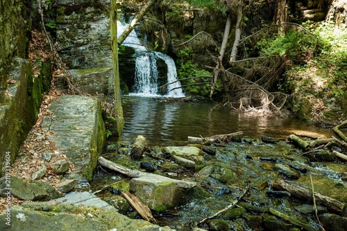 Upper waterfall on the Huntava river. Resov. North Moravia. Czechia. 