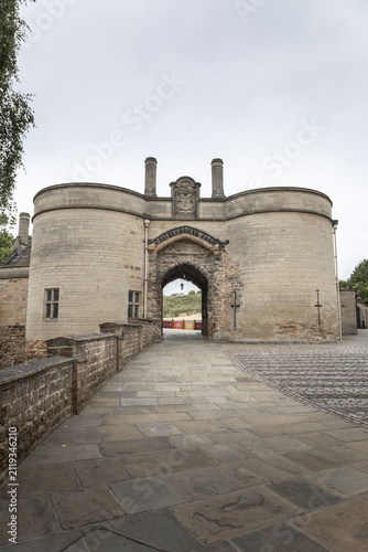 View of the historic Nottingham Castle Gatehouse with its twin towers and stone archway leading to the castle grounds in Nottingham, England, United Kingdom.