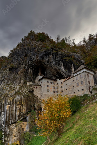 Predjama Castle (Predjamski grad), Renaissance fort built for defense under a natural rock arch high in the mountain stone wall. Postojna-Slovenia-200