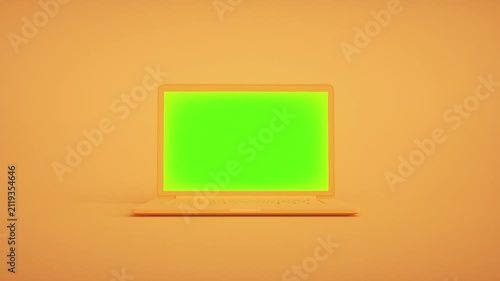 Modern Laptop With Green Screen on Vibrant Orange Background