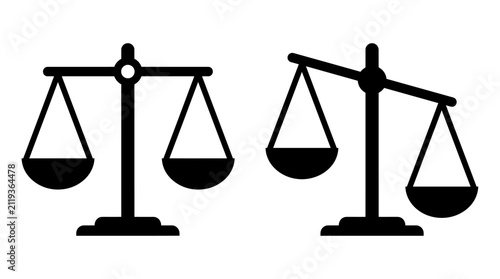 Fotografie Two scales of justice depicted as black silhouettes against a white background