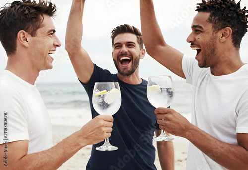 Three diverse men laughing ...