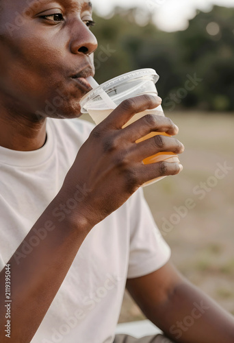 African american man drinki...