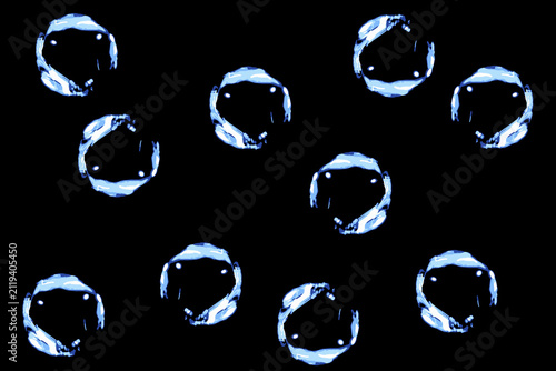 abstract background with outlines of water droplets on a black background