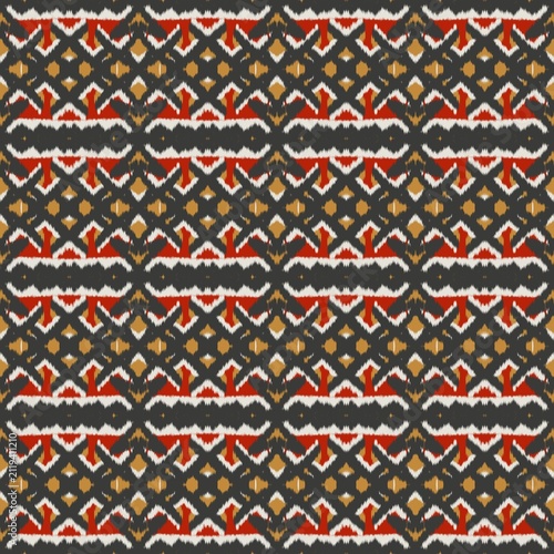 Seamless ethnic ikat pattern with bold red and gold geometric motifs on a dark grey background. Tribal fabric design perfect for bohemian prints, wallpaper, and creative decor.